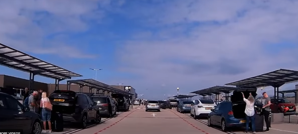 Cars parked cars on a road

Description automatically generated